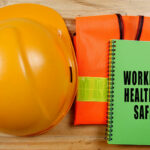 What fire safety documents should be displayed within the workplace?