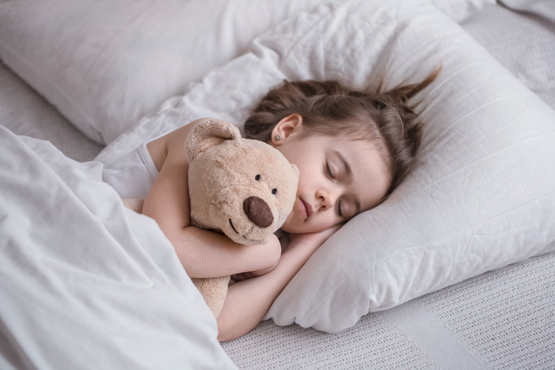 young-girl-sleeping-in-bed