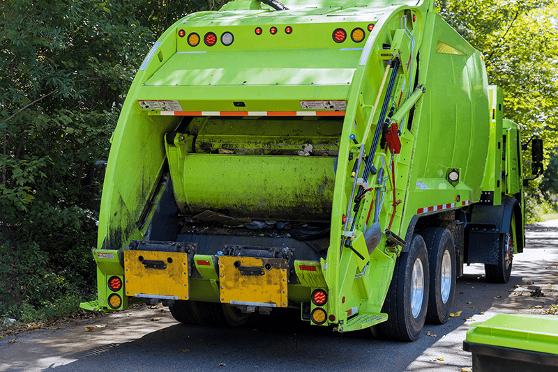 image shows a bin lorry to illustrate disposing of batteries safely